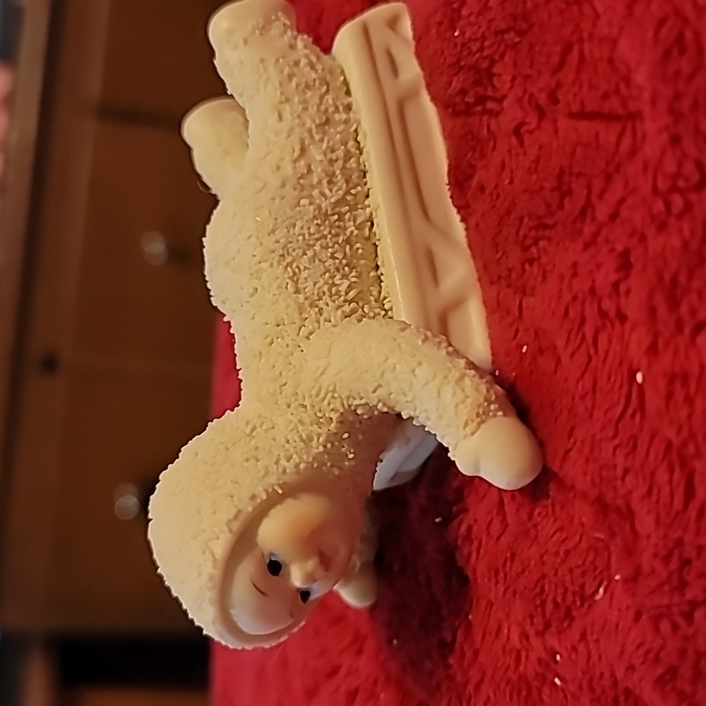 Cream Snowball Kids Figurine On Sled